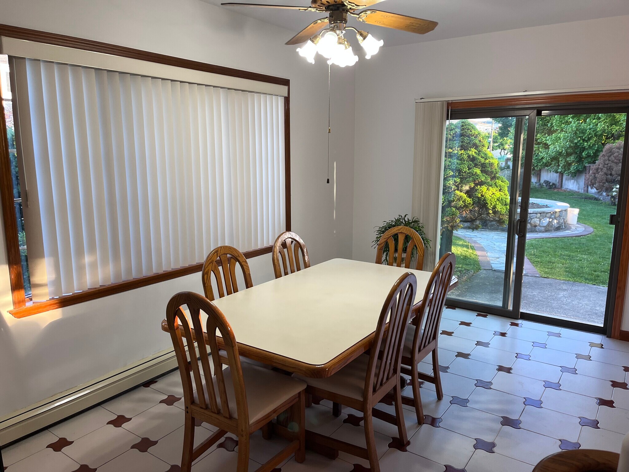 large eat in kitchen with under stair storage/pantry bay window and sliding door to garden area - 239 Kingston Ave