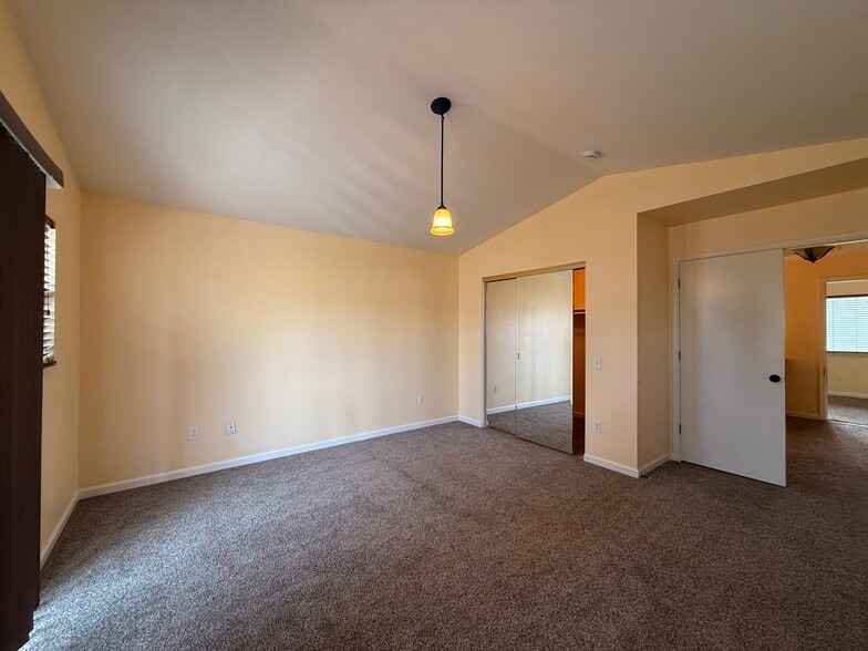 Master bedroom from balcony corner toward walk-in closet and entry - 3326 Amberfield Cir