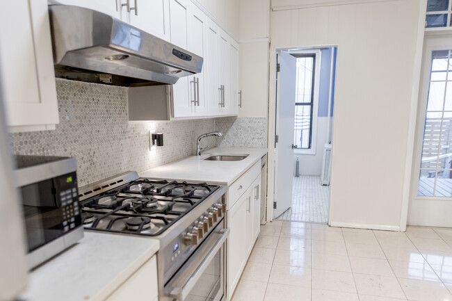 Upgraded kitchen includes new stove, counterstop, cabinets and backsplash. - 61 Duffield St