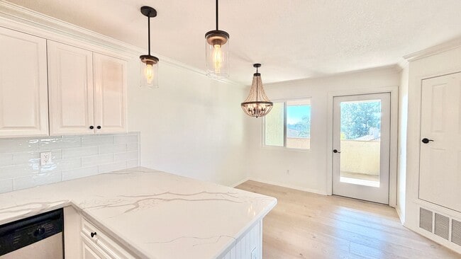 Building Photo - Beautifully Remodeled and Updated Upstairs Condo Unit in the Private & Gated Vista Way Village Co...