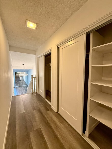 Upstairs hallway with two double door closets - 3500 W Manchester Blvd