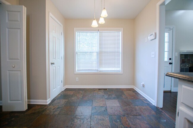 Building Photo - Pet Friendly Three Bedroom with Bonus!