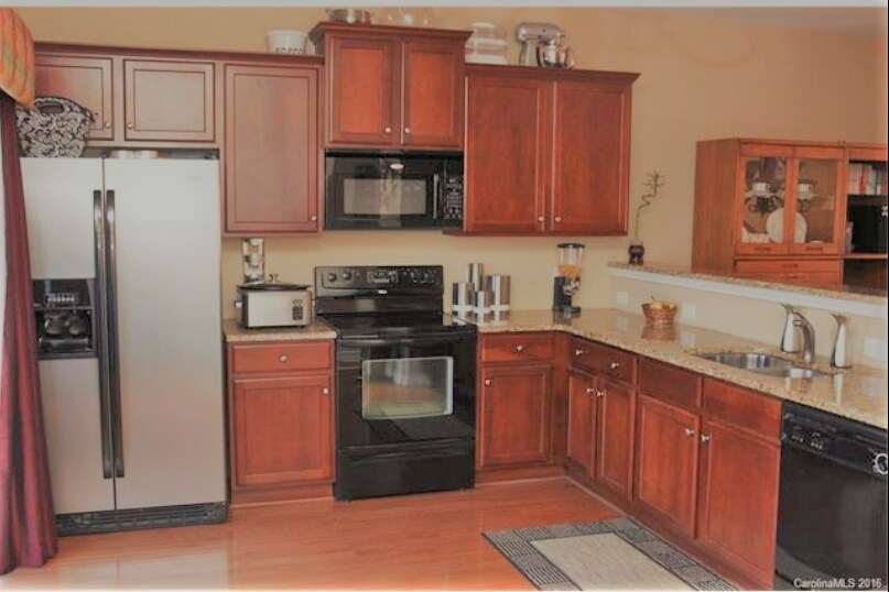 Large Granite counter top Kitchen which follows to Patio - 9792 Wlakers Glen DR NW