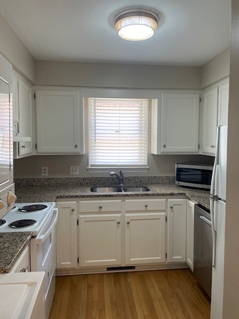 Updated galley kitchen with granite countertops. - 815 Lexington Ave