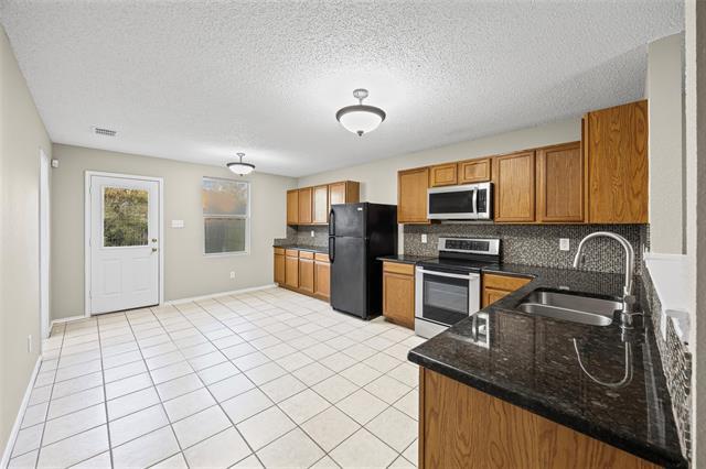 Building Photo - 8409 Redheart St