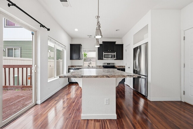 Building Photo - $2,245.95, 2 bed, 2.5 bath located in Denver with a fenced yard.