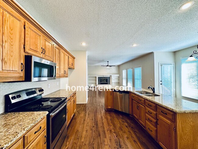 Building Photo - Blue Valley Northwest home on a cul-de-sac w/ granite counters, ss appliances and fenced yard!