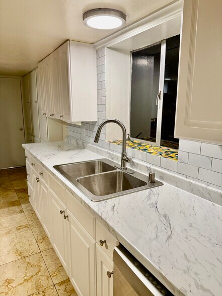 Updated kitchen - new countertop, sink, lighting and stainless steel appliances - 211 West End Ave