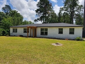 Building Photo - !!500!! Move-IN Discount  Spacious 4BR/2BA Home with Brick Exterior, Large Open Living Area, and ...