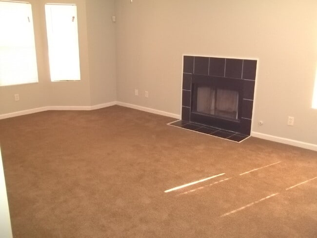 Building Photo - Freshly painted and new flooring in this 4 Bedroom 2 and Half Bath home. Covered front porch with...