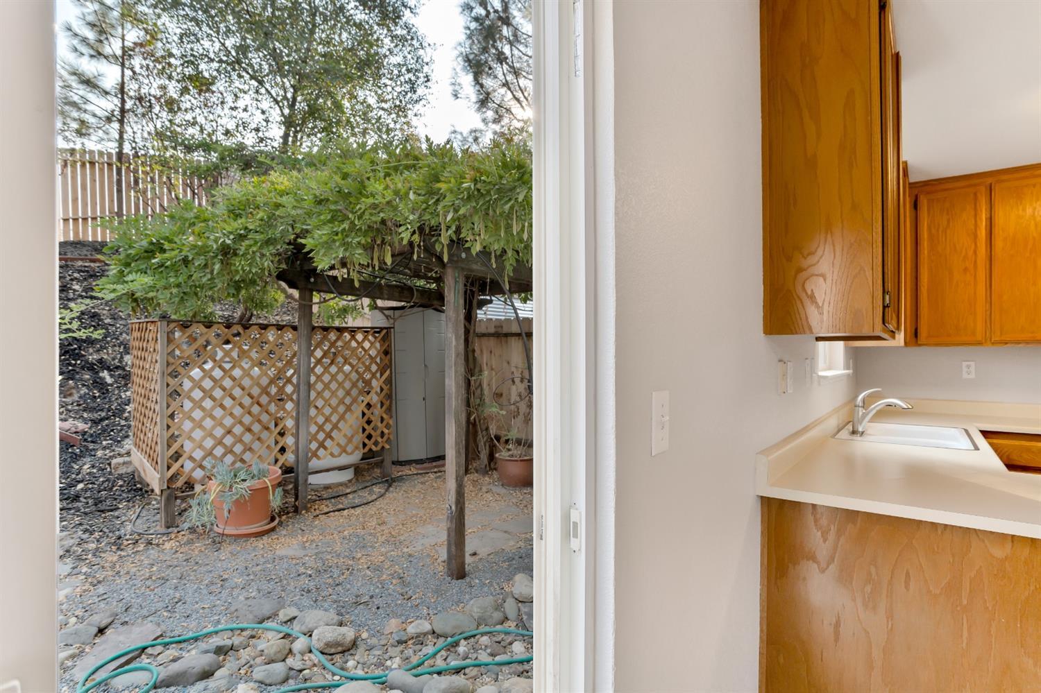 Entering the backyard from the dining room. - 3038 Courtside Dr