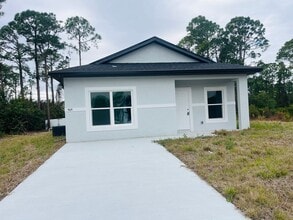 Building Photo - NEW CONSTRUCTION-  Modern 2 Bed / 2 Bath Home in South Lehigh Acres