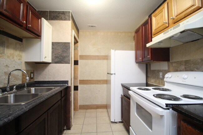 Building Photo - Updated 2BR/1BA Brick Duplex in North Pensacola with Tile Flooring Throughout, Included Utilities...
