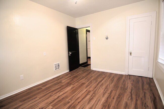 Building Photo - This 2 bedroom 1 bath home has been completely refinished with brilliant hardwood floors throughout!