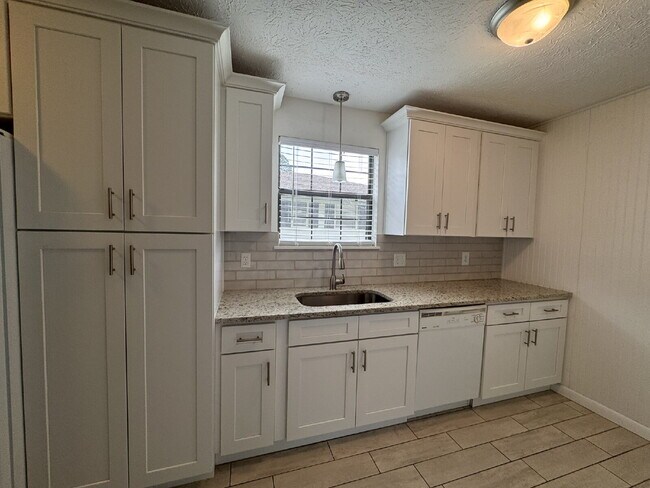 Building Photo - Updated Home with Spacious Backyard