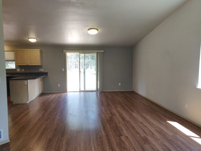 Building Photo - Charming 4-Bedroom Home on 1/2 Acre with a Fenced Backyard, Fully Insulated Double-Car Garage, in...