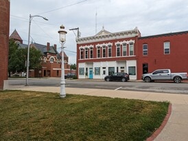 View of building and courthouse next door - 114 S Pearl St