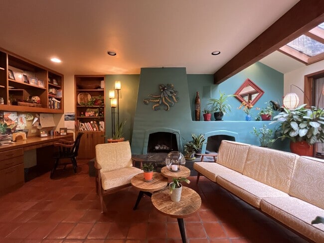 Building Photo - One-of-a-Kind Custom Home with Wall of Windows, Stone Fireplaces, Expansive Entertainment Space &...