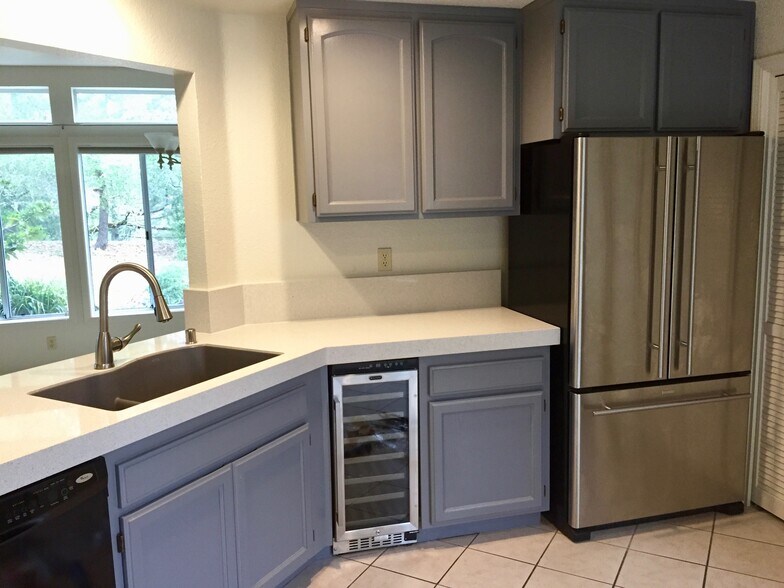 Kitchen w/ wine cooler & fridge - 2103 Stonefield Ln