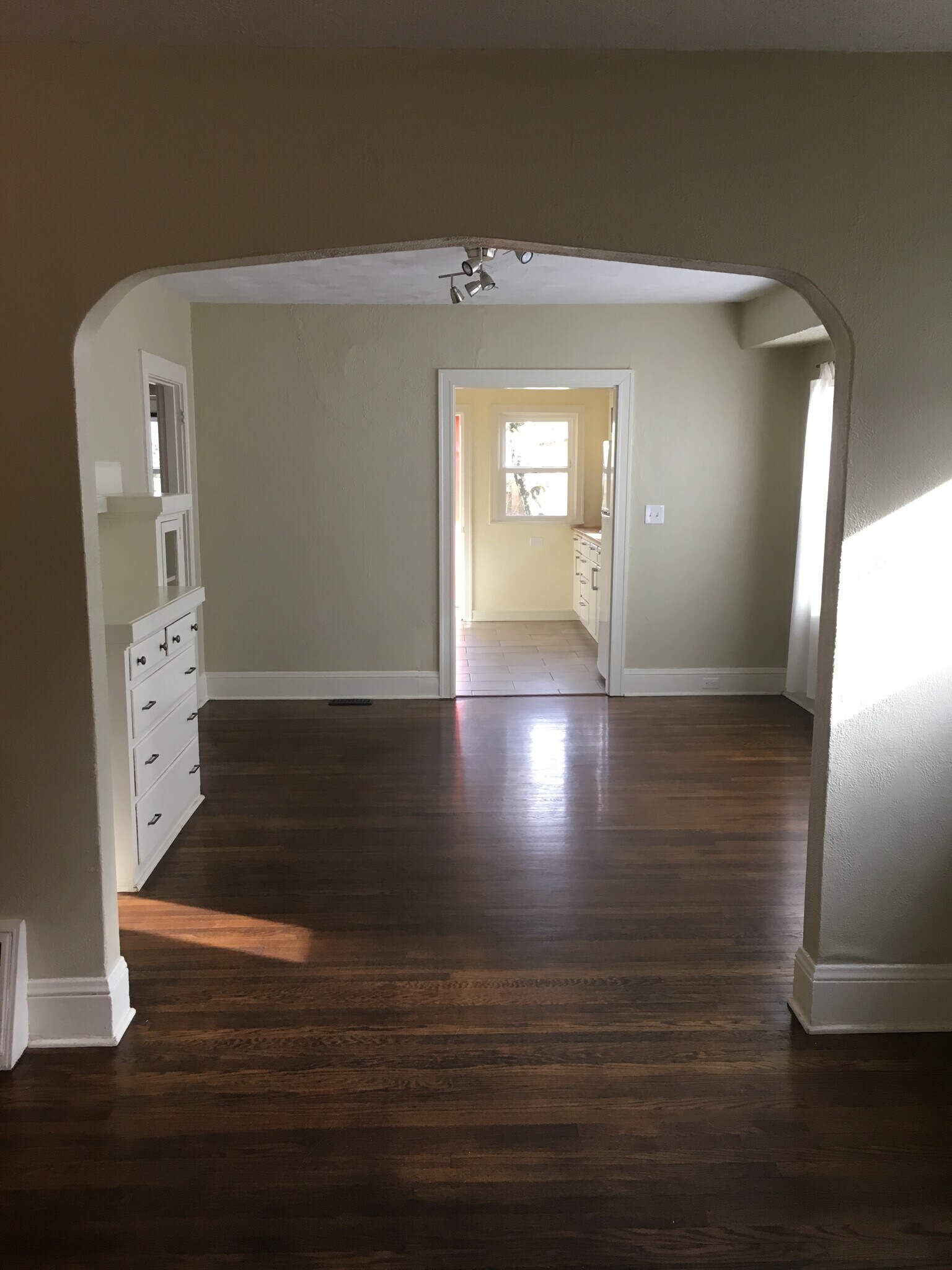 Living room flows into dining room with lovely built-ins! - 5726 North Montana Avenue