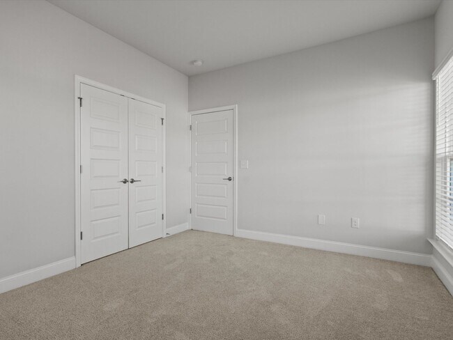 Building Photo - 3 Car Garage! Modern end-unit townhome located in the desirable Clift Farm!