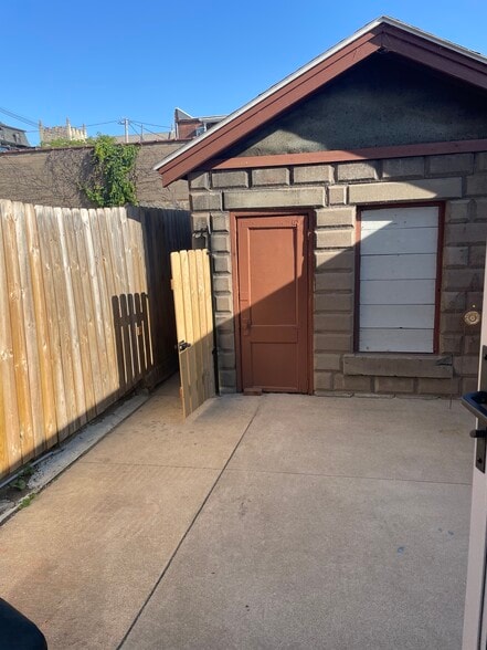 Small private back courtyard. Fenced! - 107 W 13th St