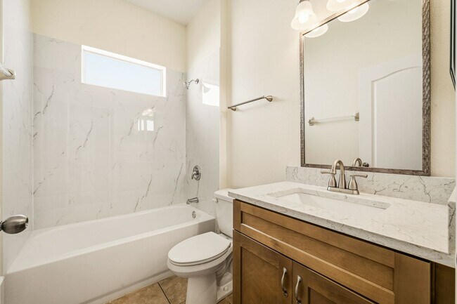 Building Photo - Cozy 4/2 Home Nestled in a Gated Community