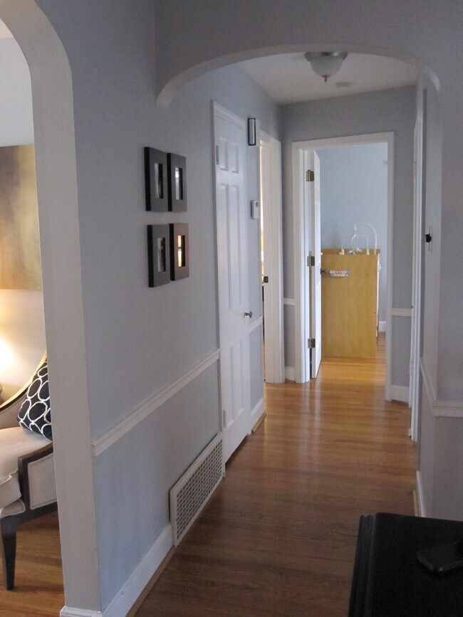 Hallway to upstairs bedrooms - 8666 Rosalie Ave