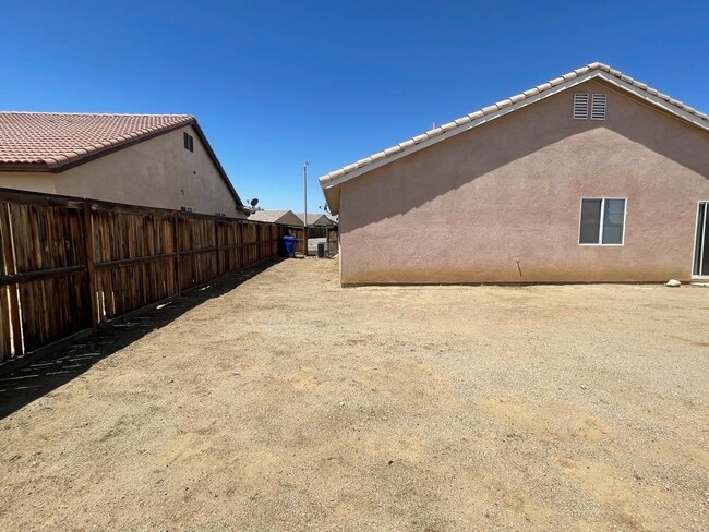 Building Photo - Adelanto Home-3 Bedrooms,2 Bathrooms, Laminate Floors, Indoor Laundry Room, Large Back Yard