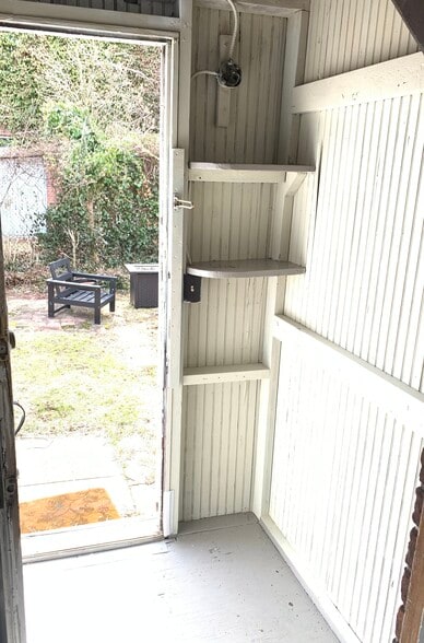 Storage area and kitchen door to yard - 22 Lyon St