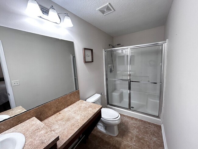 Building Photo - Newer Build 3/2 with Fenced in yard minute...