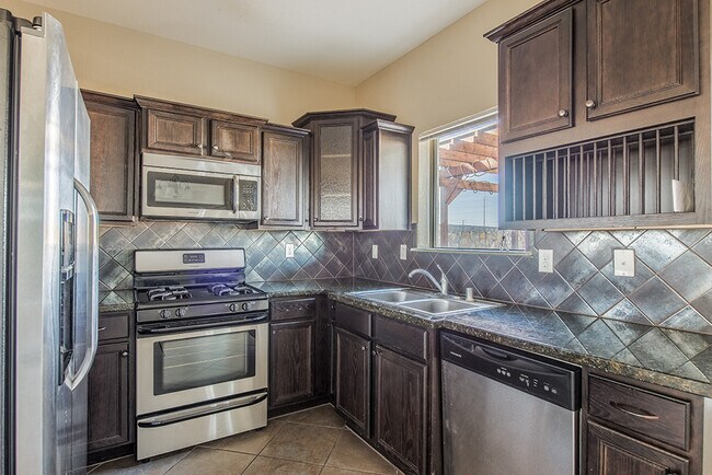 Building Photo - Beautiful 4-Bedroom Home with Custom Backy...