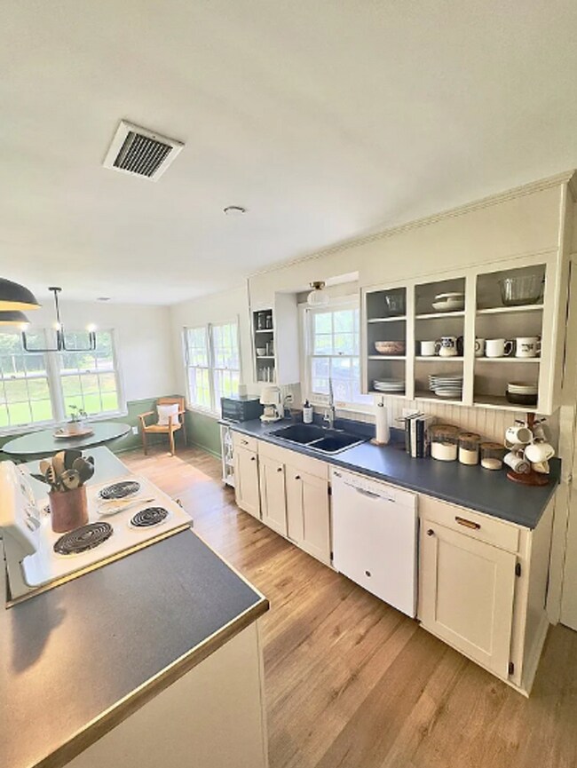 Building Photo - featuring an open layout - rent to own!