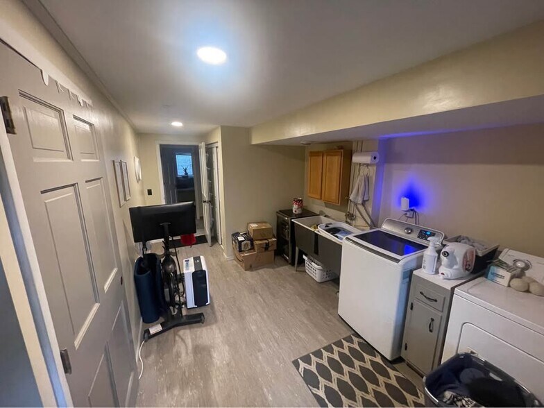 laundry room with walkout to backyard - 5853 Winnetka Ave N
