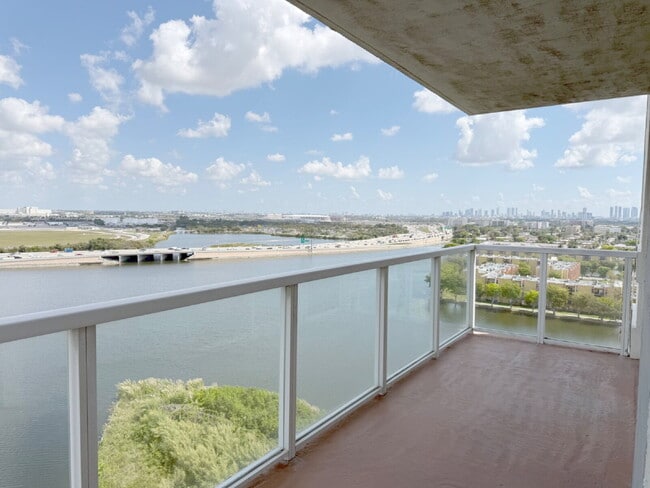 Building Photo - Rare 2/2 Corner Penthouse with Panoramic Lagoon Views from Every Room – Available Now!