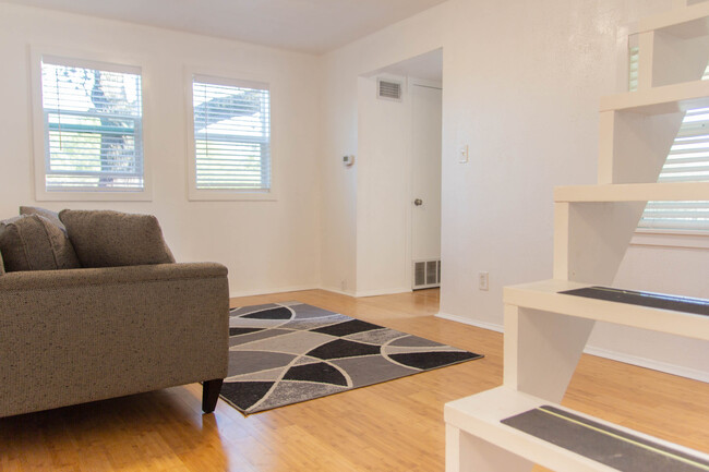 Living room, part 2! Staircase leads to bedroom. - 100 Beaver St