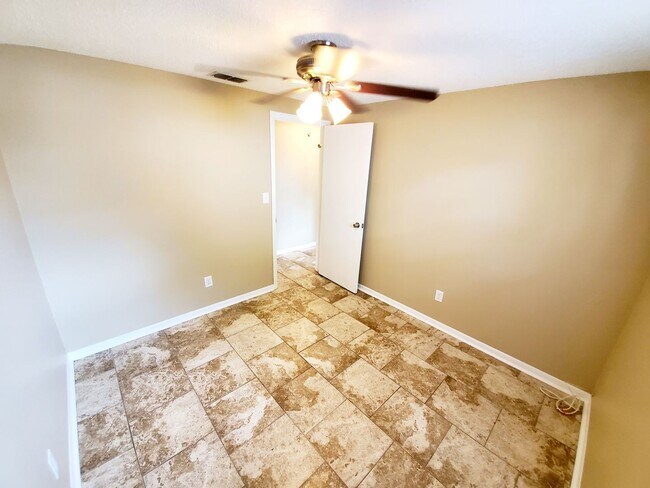 Building Photo - Three bedroom one and a half bathroom house with large yard space