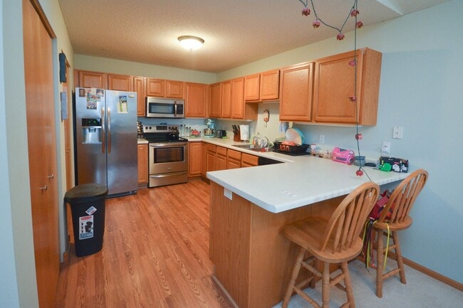 Building Photo - One level living in this end unit townhome!