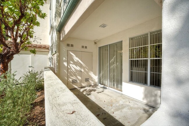 Building Photo - Coastal Living at Its Best – Upgraded 1BR Condo with Private Patio & Resort-Style Amenities