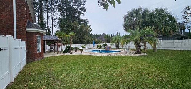 Building Photo - “Elegant 5-Bed Executive Home with Pool – ...