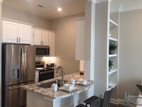 Building Photo - Luxury Living – Steps from Everything!!