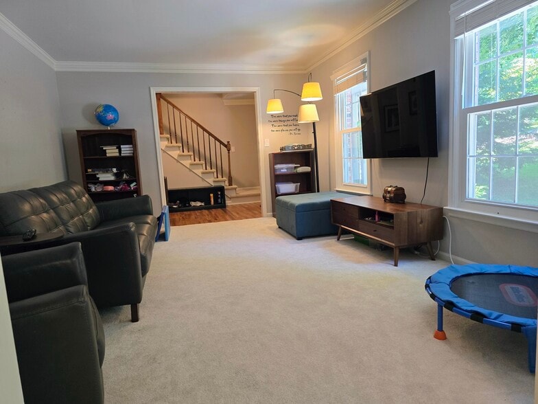 Spacious carpeted formal living room - 90 Martin Point Ct