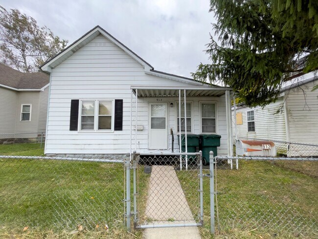 Building Photo - Fall into this cozy 3-Bedroom Home with a fenced in yard & detached garage!