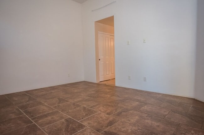 Building Photo - Gorgeous 3 Bedroom 2 Bathroom Home with Tile Throughout! Central A/C, 2 Car Garage!