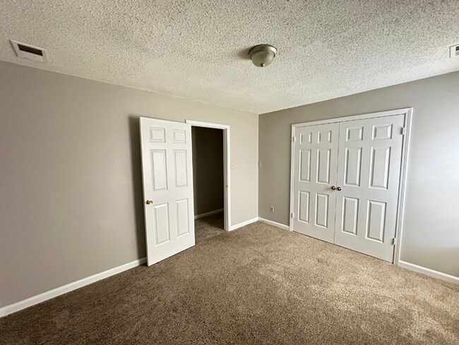 Building Photo - Grand 4BR/2BA Near Southwind | 2,438 Sq Ft, Stone Fireplace, Soaking Tub & 2-Car Garage