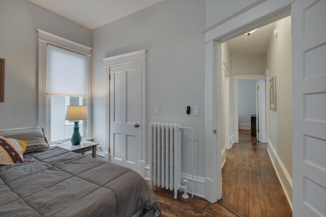 View from the smaller bedrom to the medium bedroom. Bathroom is on the left. - 3020 Columbus Ave