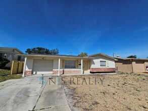 Building Photo - True 2/1.5/1 with FIREPLACE, fenced yard and all tile flooring throughout!