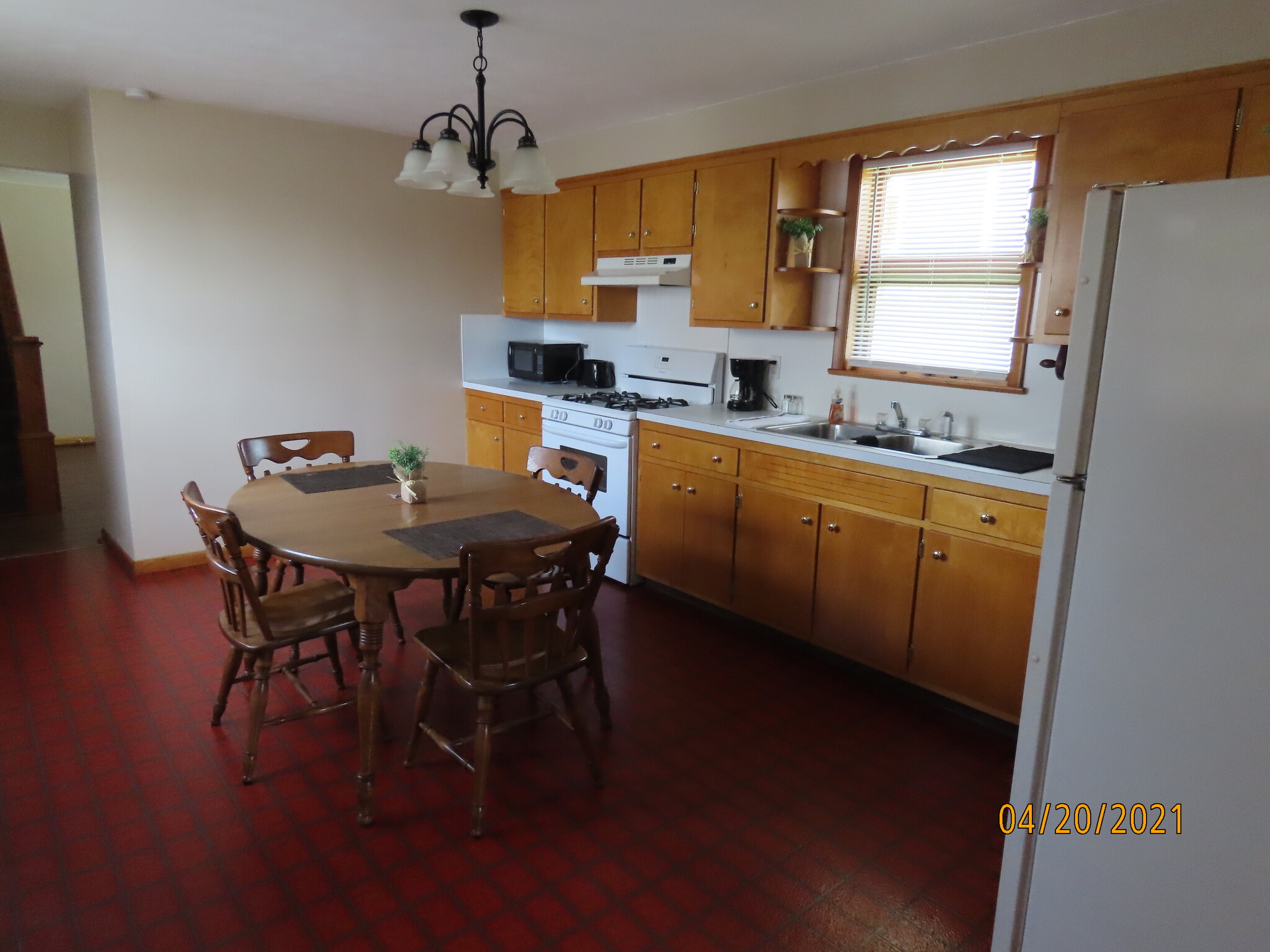 Full size refrigerator, gas cooking stove, microwave, coffee pot, toaster... - 307 Center St