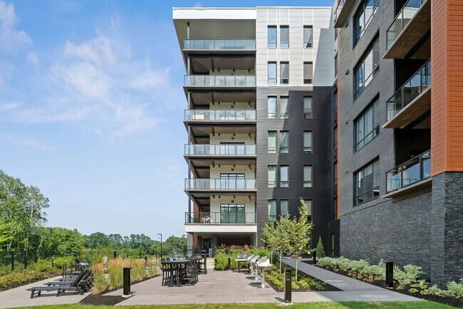 Building Photo - 2 Bedroom Corner-Unit with Wooded Balcony ...