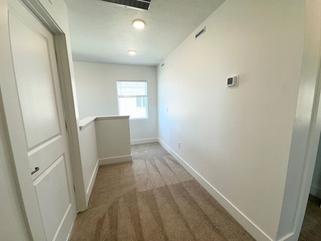 Building Photo - Spacious Luxury Townhome Designed for Modern Living